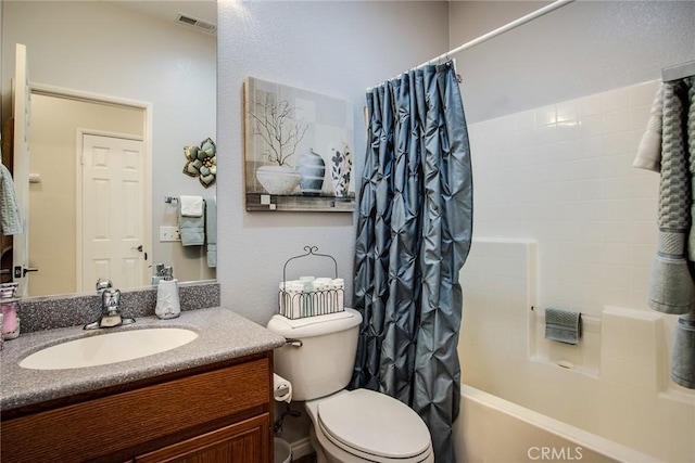 full bathroom with shower / bath combination with curtain, visible vents, vanity, and toilet