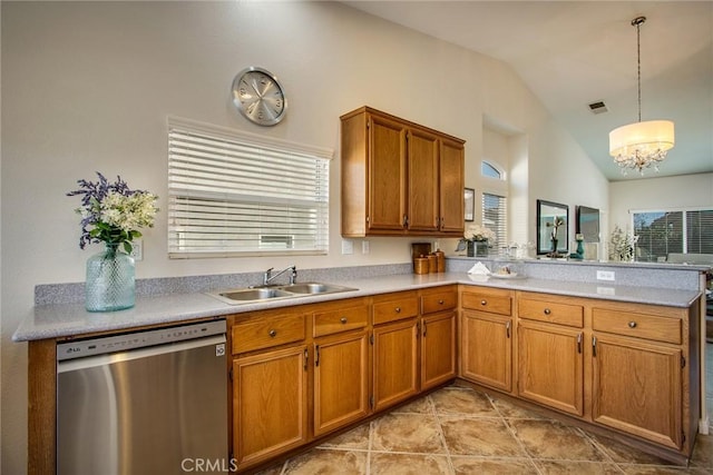 kitchen featuring pendant lighting, light countertops, a sink, dishwasher, and a peninsula