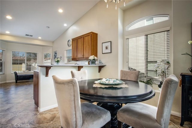 dining area featuring high vaulted ceiling, recessed lighting, visible vents, and a healthy amount of sunlight