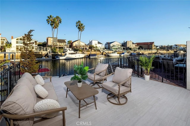 view of patio with a water view and a balcony