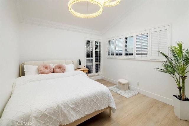 bedroom featuring wood-type flooring and ornamental molding