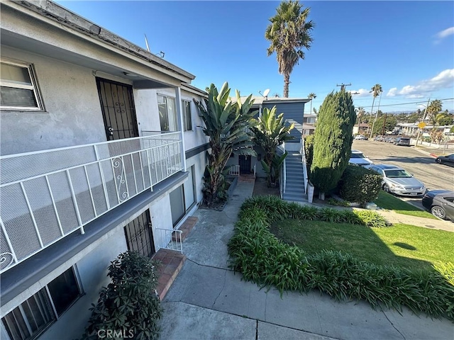 view of side of home featuring a lawn