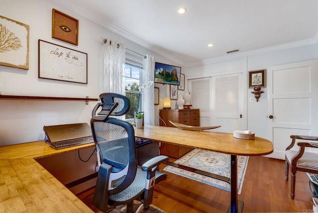 home office featuring ornamental molding and hardwood / wood-style floors