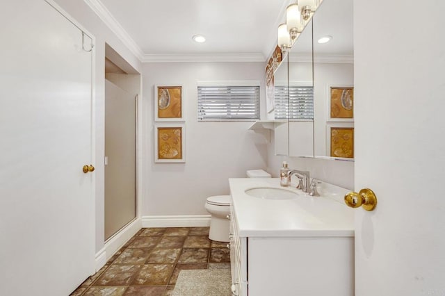 bathroom with vanity, toilet, crown molding, and walk in shower