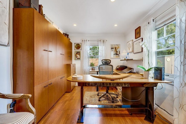 office featuring ornamental molding and light hardwood / wood-style floors