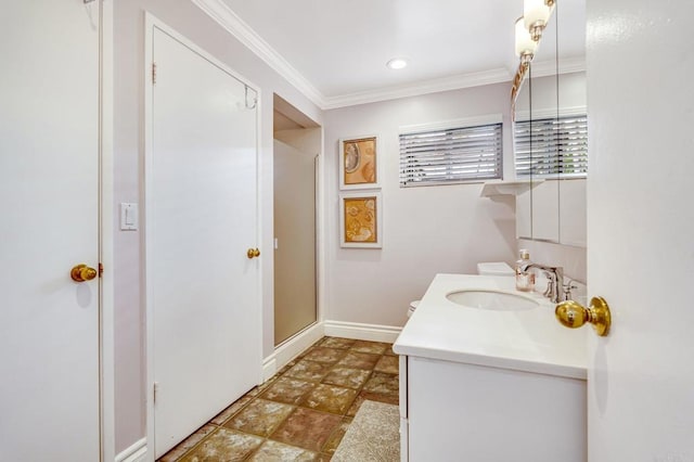 bathroom featuring an enclosed shower, vanity, and crown molding