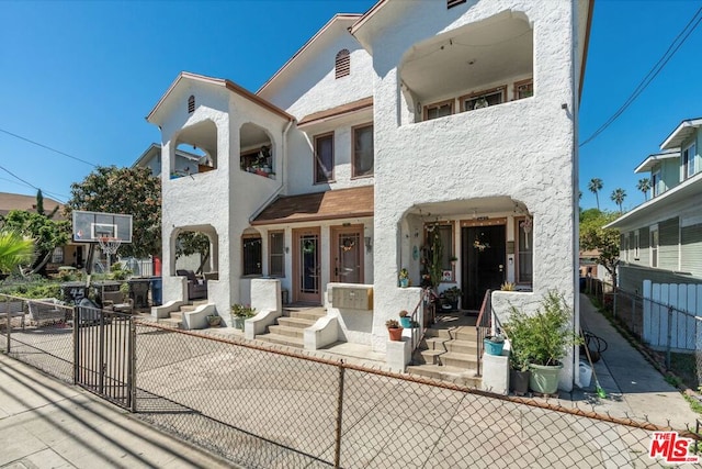 view of front of house with a balcony