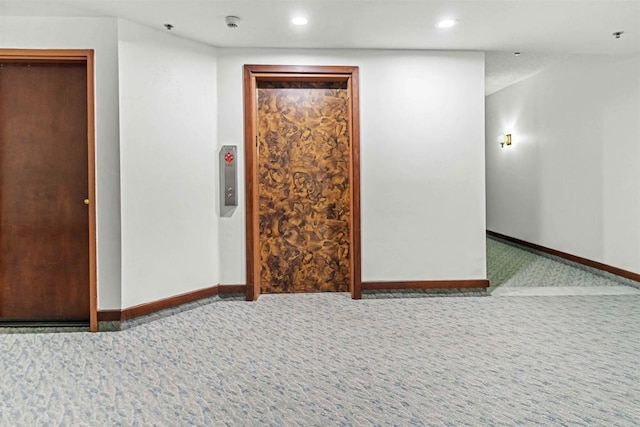 empty room featuring carpet flooring