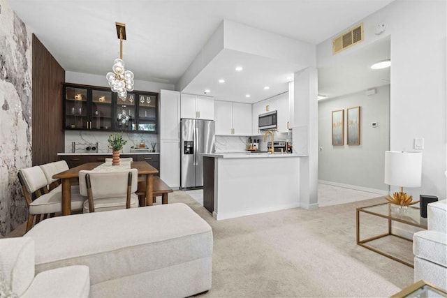 living room featuring light colored carpet