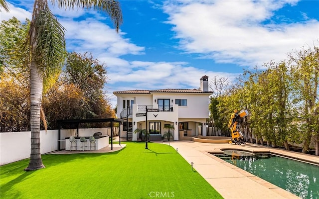 23123 Oxnard St, Woodland Hills, CA 91367 - back of house featuring a balcony, a patio, a chimney, and stucco siding