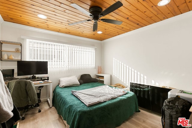 bedroom with ceiling fan, light wood-type flooring, wood ceiling, and ornamental molding