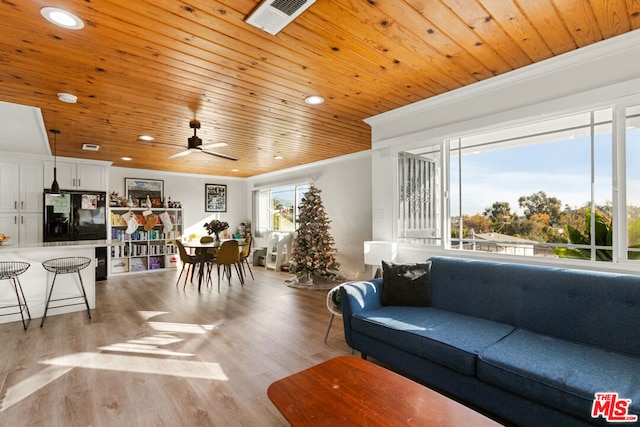 living room with wooden ceiling, light hardwood / wood-style floors, and a healthy amount of sunlight