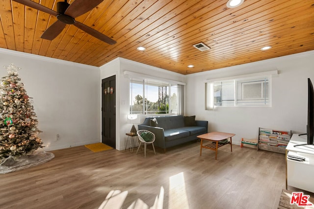 living room with light wood-type flooring, ceiling fan, ornamental molding, and wood ceiling