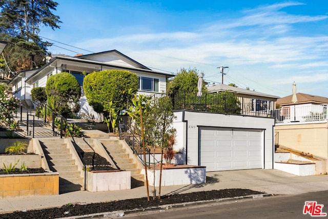 view of front of property featuring a garage