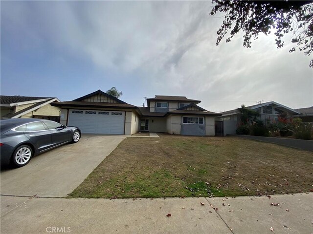 view of front facade with a front lawn and a garage