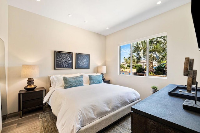 bedroom with hardwood / wood-style flooring