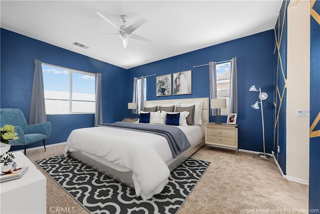 carpeted bedroom with ceiling fan