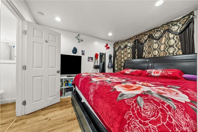 bedroom featuring hardwood / wood-style flooring