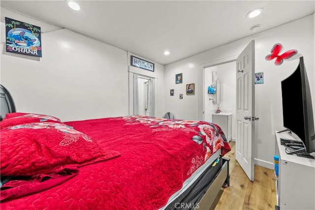 bedroom with light hardwood / wood-style flooring