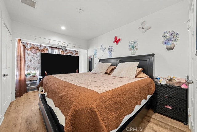 bedroom featuring light hardwood / wood-style floors