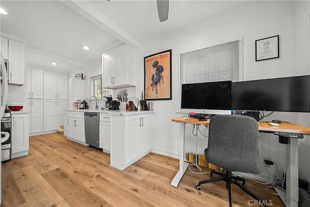 kitchen with white cabinets, stainless steel dishwasher, and light wood-type flooring