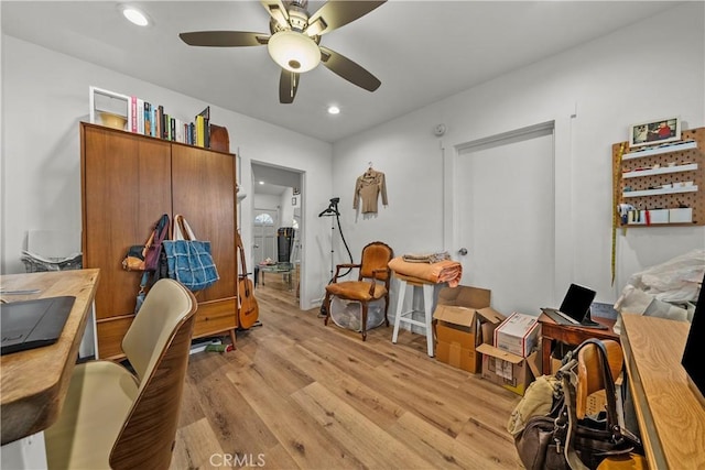 interior space featuring light hardwood / wood-style floors and ceiling fan