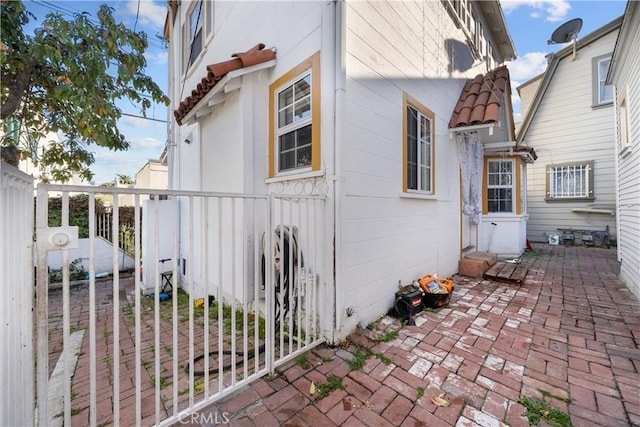 view of side of home featuring a patio