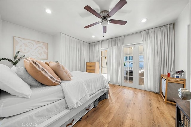 bedroom with ceiling fan, access to outside, and light hardwood / wood-style flooring