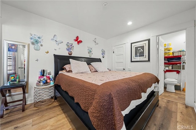 bedroom featuring wood-type flooring