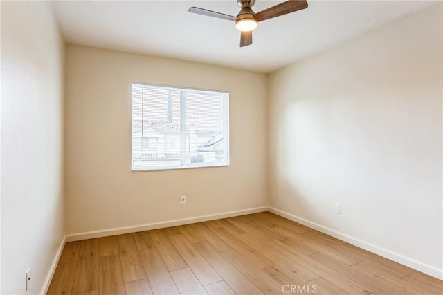 spare room with ceiling fan and light hardwood / wood-style flooring