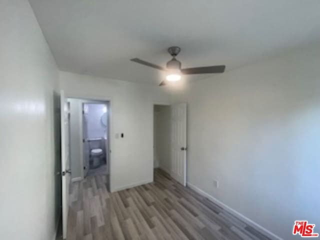 unfurnished bedroom featuring ceiling fan and light hardwood / wood-style floors