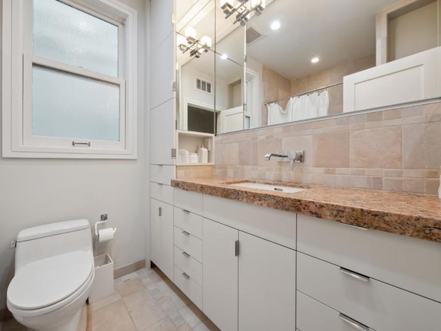 bathroom with a shower with curtain, decorative backsplash, toilet, and vanity