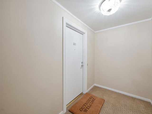 doorway to outside with crown molding