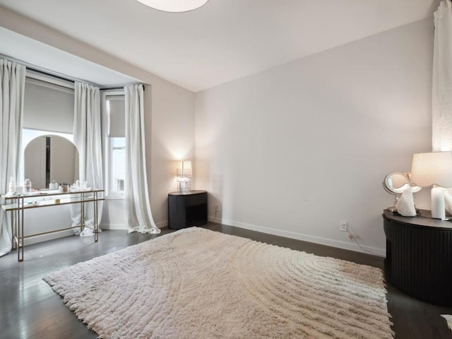 bedroom featuring dark hardwood / wood-style flooring