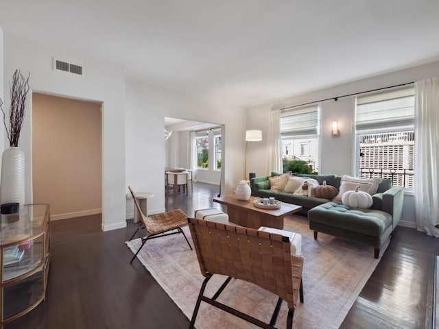 living room with dark hardwood / wood-style floors