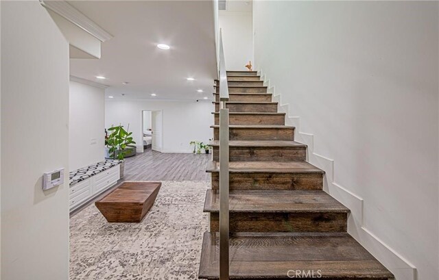 stairway featuring hardwood / wood-style floors