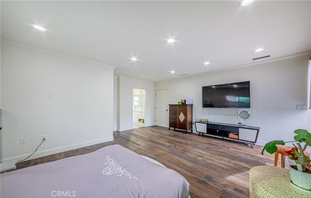 bedroom featuring hardwood / wood-style flooring and ornamental molding