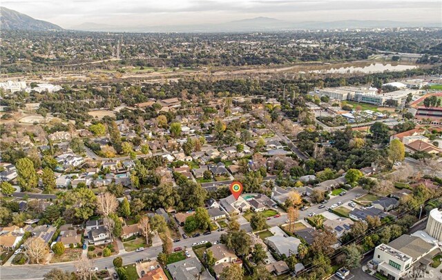 birds eye view of property with a mountain view