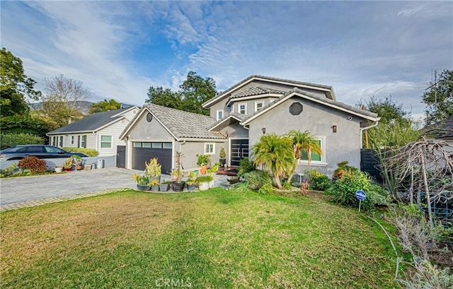 view of front of house with a front yard and a garage