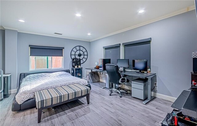 bedroom featuring crown molding and light hardwood / wood-style flooring