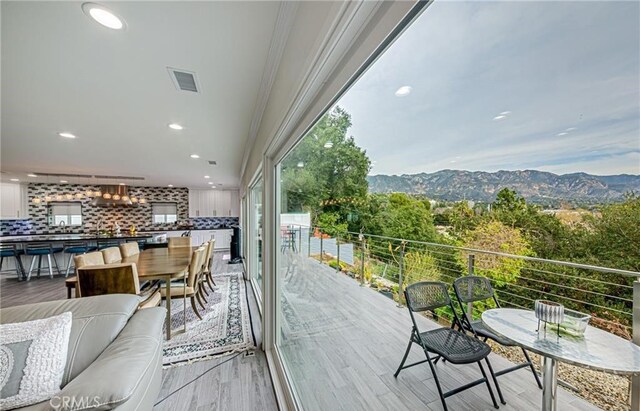 balcony with outdoor lounge area and a mountain view