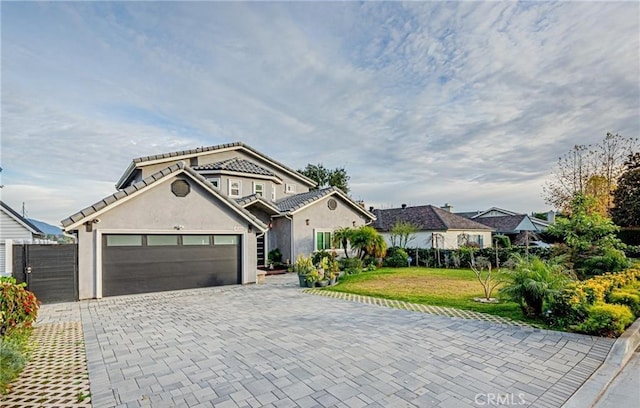 view of front of house featuring a garage and a front yard