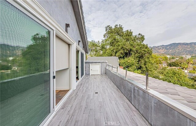 wooden terrace with a mountain view