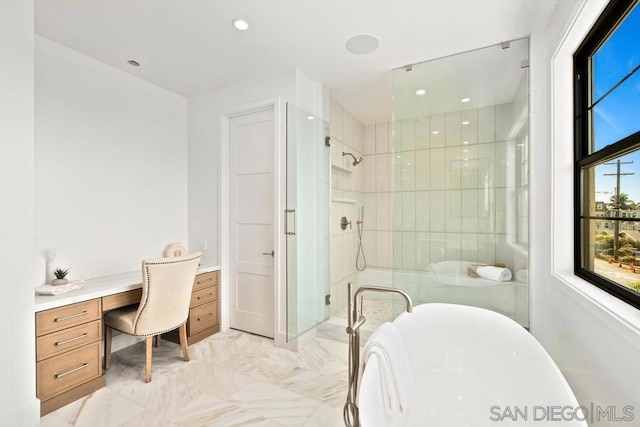 bathroom with shower with separate bathtub