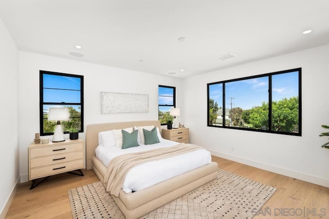 bedroom with light hardwood / wood-style floors