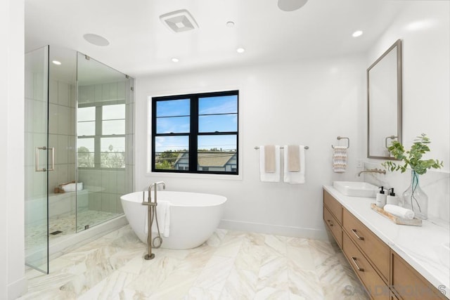 bathroom featuring vanity and plus walk in shower