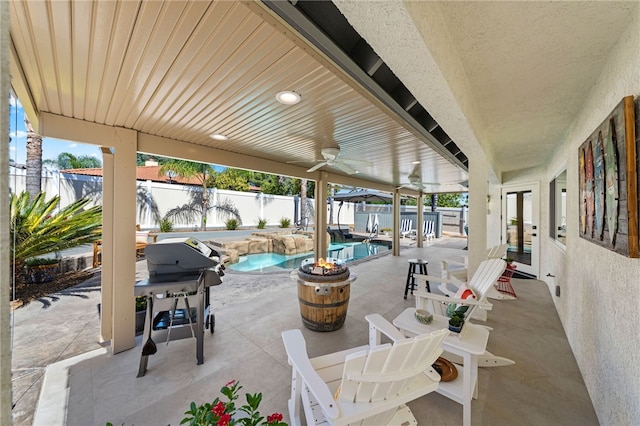 view of patio featuring a fenced backyard, a fenced in pool, and french doors