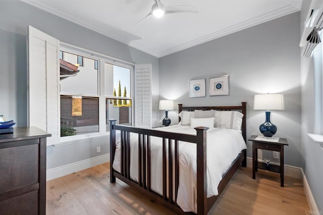 bedroom featuring ceiling fan, ornamental molding, and light hardwood / wood-style floors