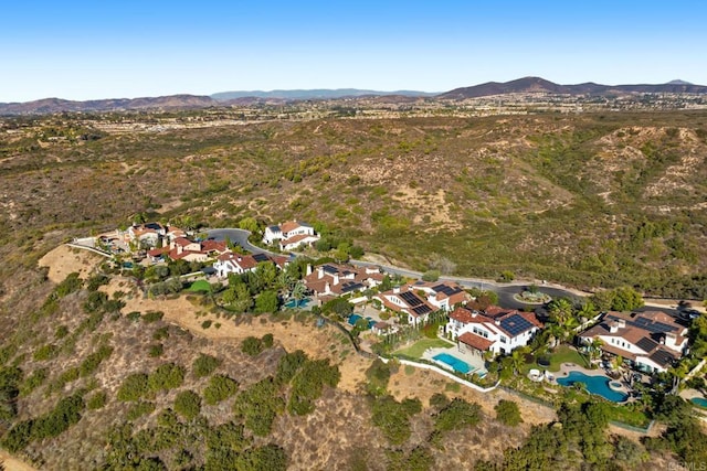 birds eye view of property featuring a mountain view