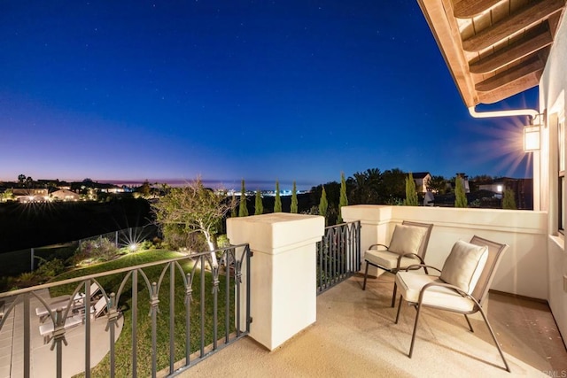 view of balcony at dusk